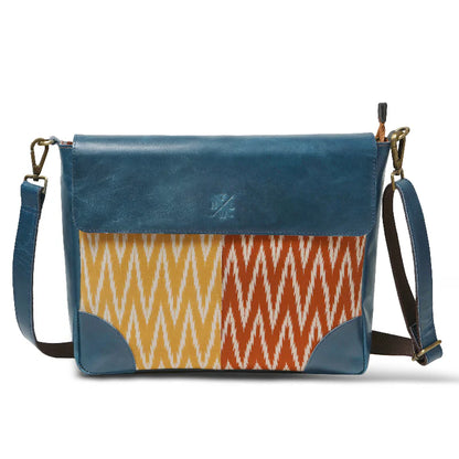 Blue and patterned shoulder bag on a white background