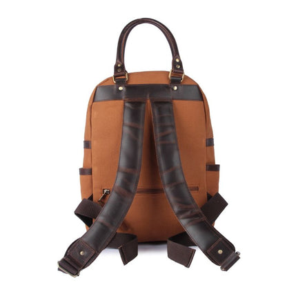 Brown backpack with leather straps on a white background