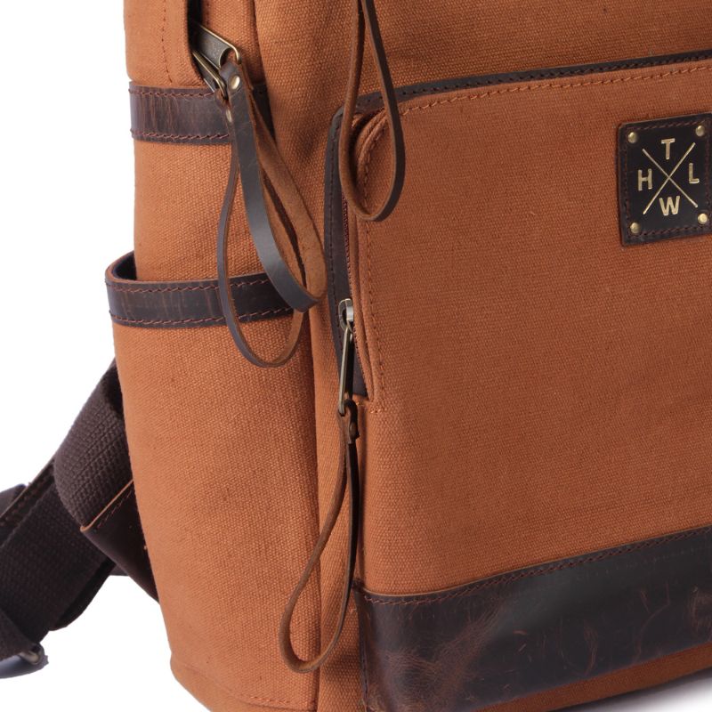 Brown backpack with visible brand logo on a white background