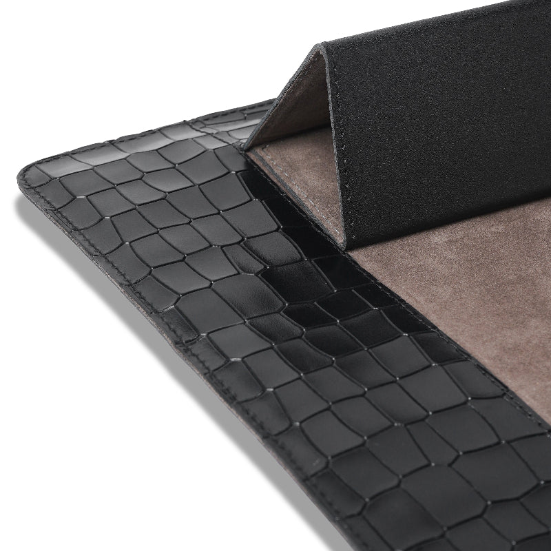 Black crocodile-patterned leather Laptop with gray interior on a white background