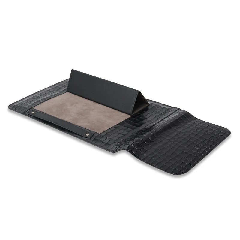 Black mat/sleeve with textured surface on a white background