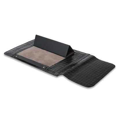 Black mat/sleeve with textured surface on a white background