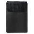 Black leather sleeve with textured flap on a white background