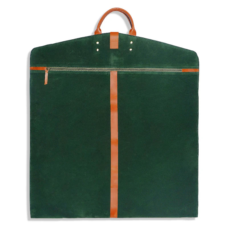 Green garment bag with brown leather straps on a white background