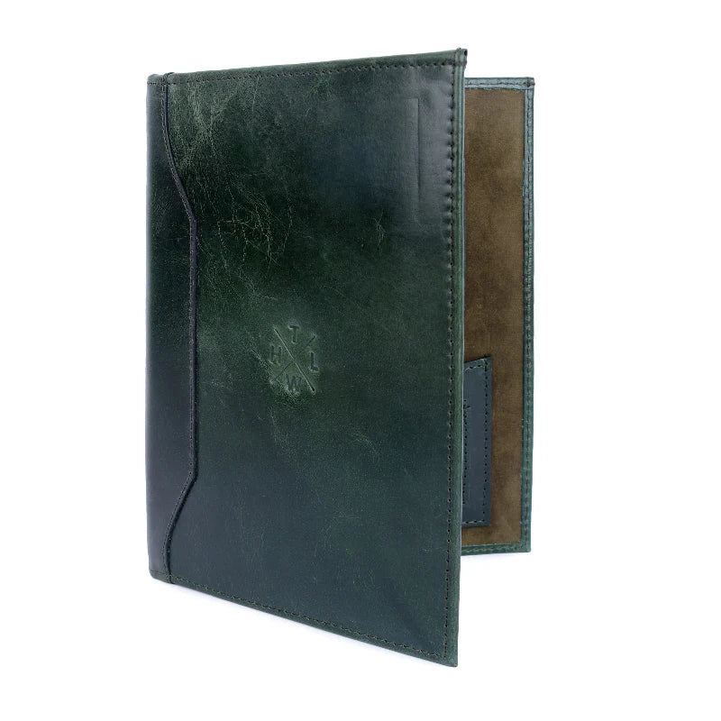 Green leather menu cover with a brown interior on a white background