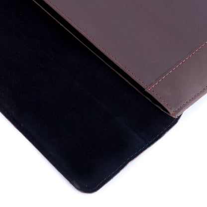 Close-up of a brown leather product on a black surface