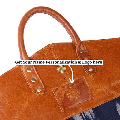 Brown leather garment bag with a visible brand logo on a white background
