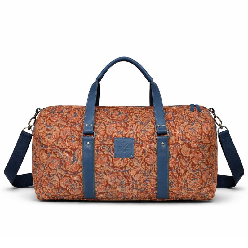 Patterned duffel bag with blue straps on a white background
