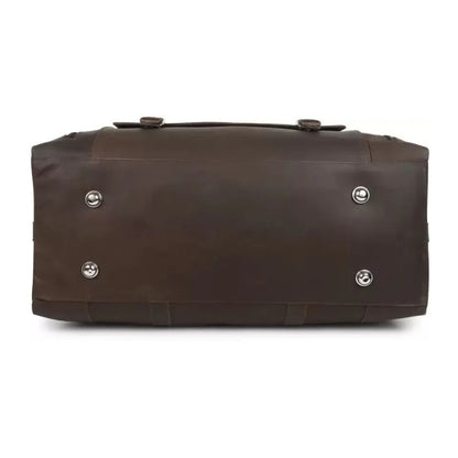 Brown leather duffel bag with silver rivets on a white background