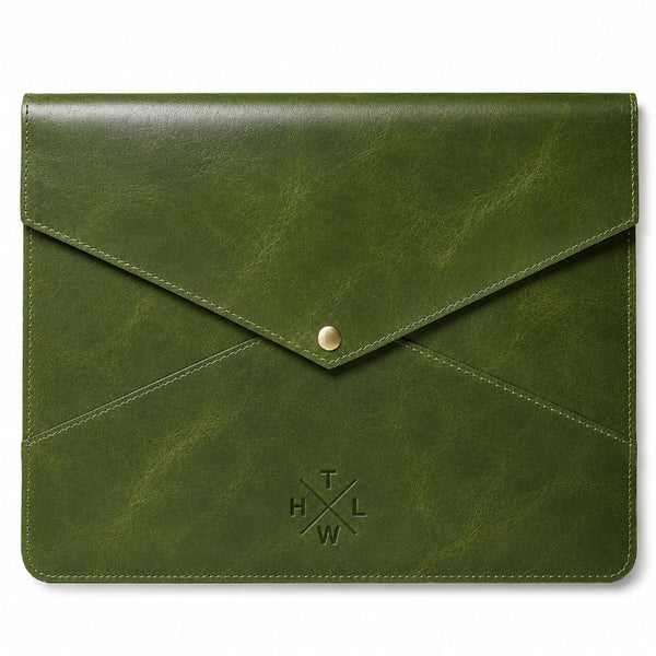 An olive green leather envelope-style pouch with a gold snap button closure and an embossed cross logo on the front, shown against a plain white background.