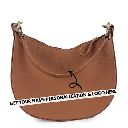 Brown leather sling  handbag with a visible brand logo on a white background