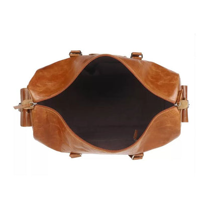 Brown leather bag with gold hardware on a white background