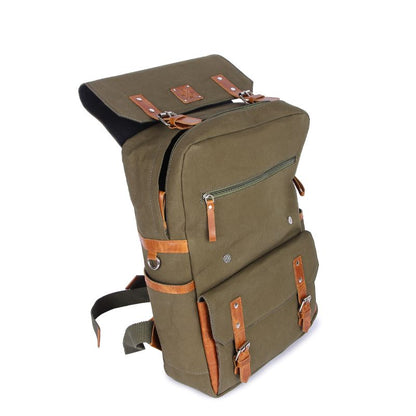 Green backpack with brown leather straps on a white background