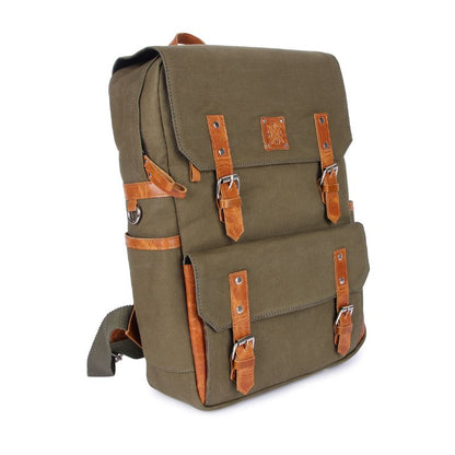 Green backpack with brown leather straps on a white background