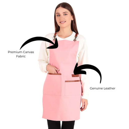 Woman wearing a pink apron with text indicating premium canvas fabric and genuine leather.