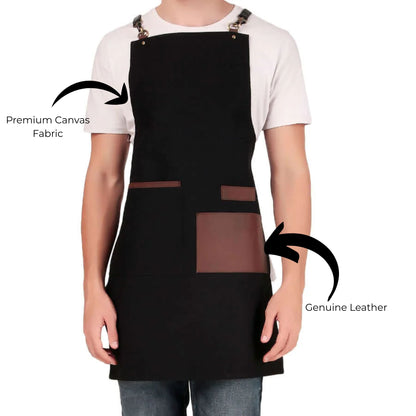 Black apron with premium canvas fabric and genuine leather accents on a white background
