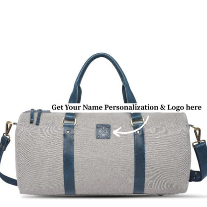 Gray duffel bag with blue straps on a white background