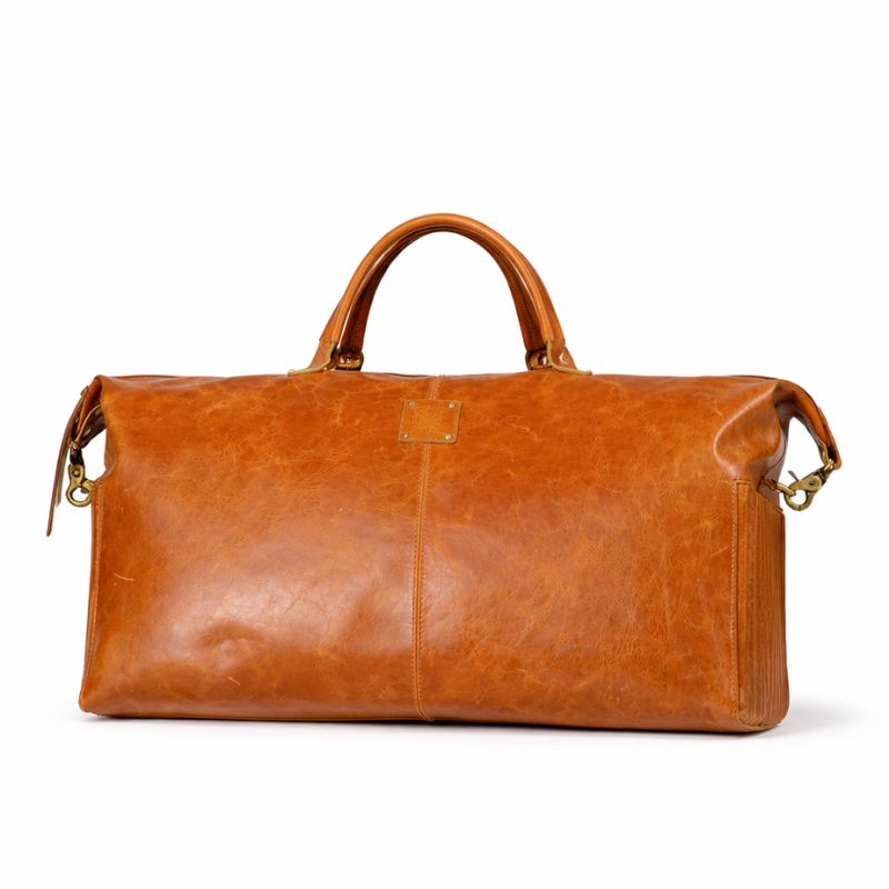 Brown leather duffel bag on a white background