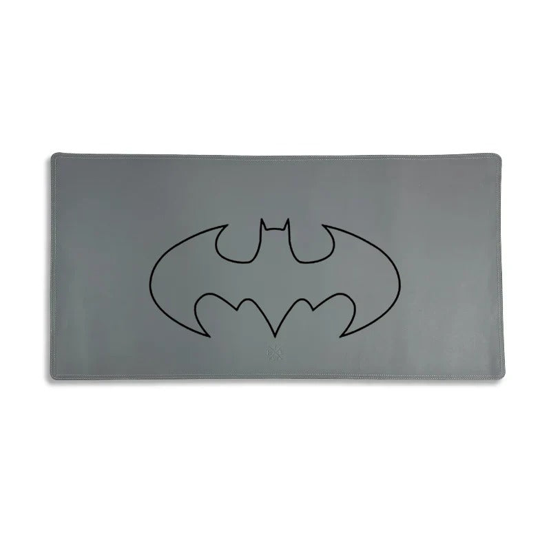 Gray mouse pad with a black Batman logo on a white background