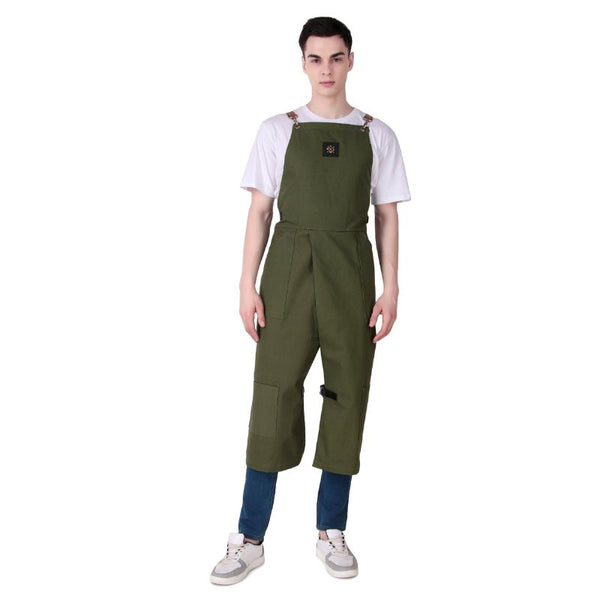 Person wearing green bib overalls on a white background