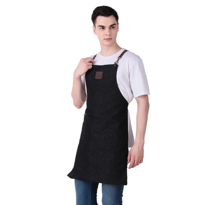 Person wearing a black apron with a brown leather patch on a white background