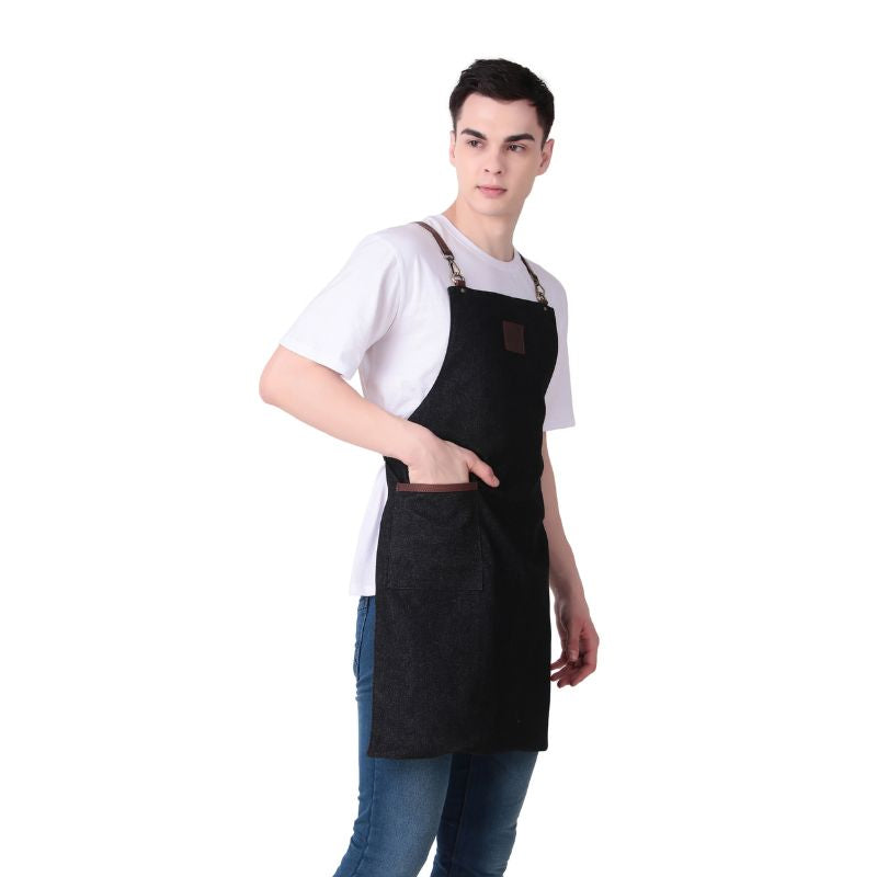 Person wearing a black apron on a white background