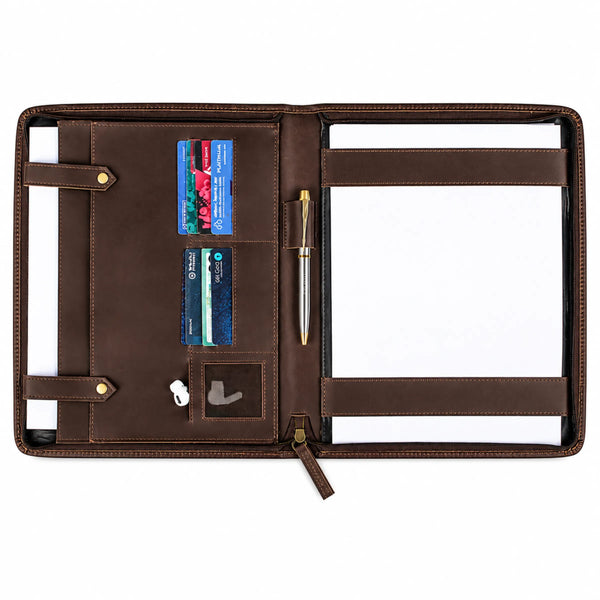 An open brown leather organizer portfolio cover on a white background, featuring card slots, a pen loop, elastic bands, and pockets with a pen, cards, and earbuds inside.