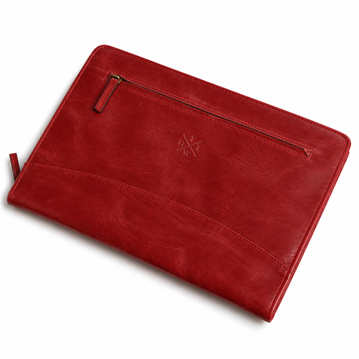 Burgundy leather portfolio photographed at an angle showing the front zipper, embossed logo, and curved pocket
