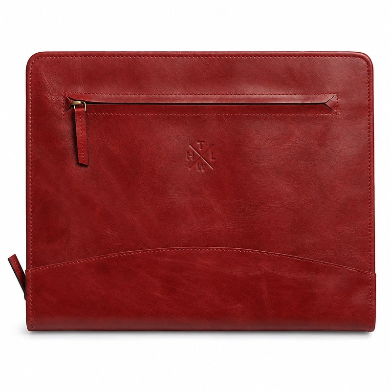 Burgundy leather portfolio featuring a front zipper pocket, embossed logo, and curved document pocket