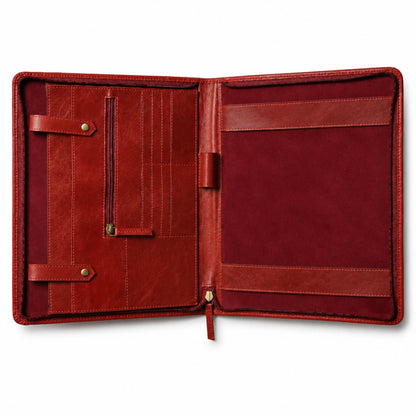 Open burgundy leather portfolio organizer with card slots, a vertical zipper pocket, and document compartments