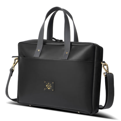Black handbag with gold accents on a white background
