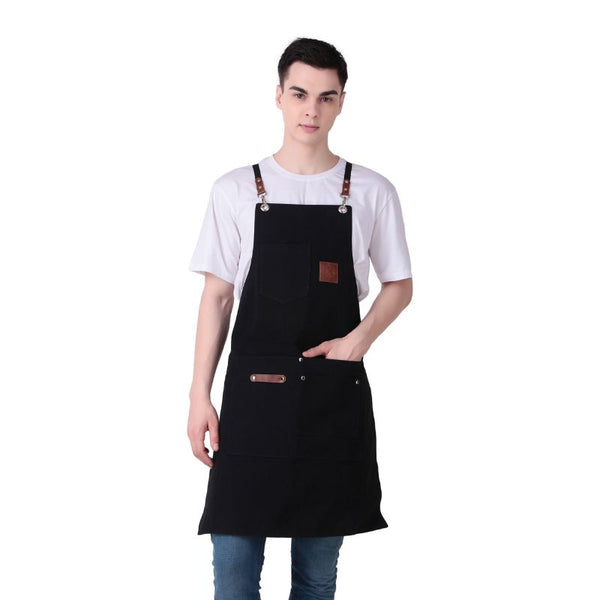 Person wearing a black apron on a white background
