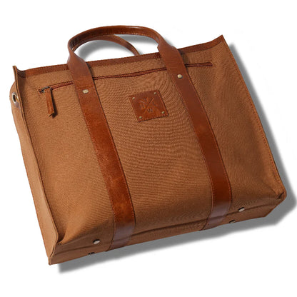 Brown leather bag with a prominent brand logo on a white background