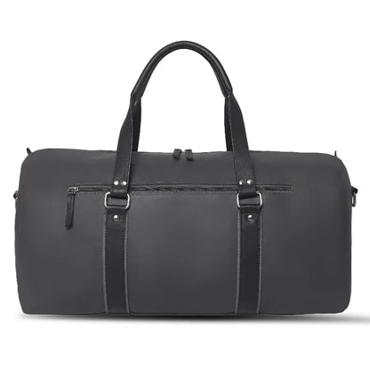 Black duffel bag with leather straps on a white background