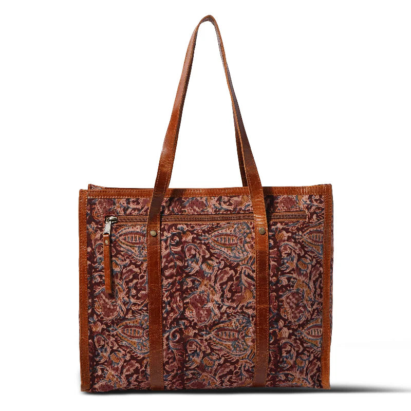 Brown patterned tote bag with shoulder straps on a white background