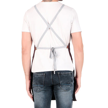 Person wearing a white shirt, gray apron, and blue jeans on a white background