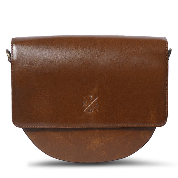 Brown leather bag with a visible brand logo on a white background