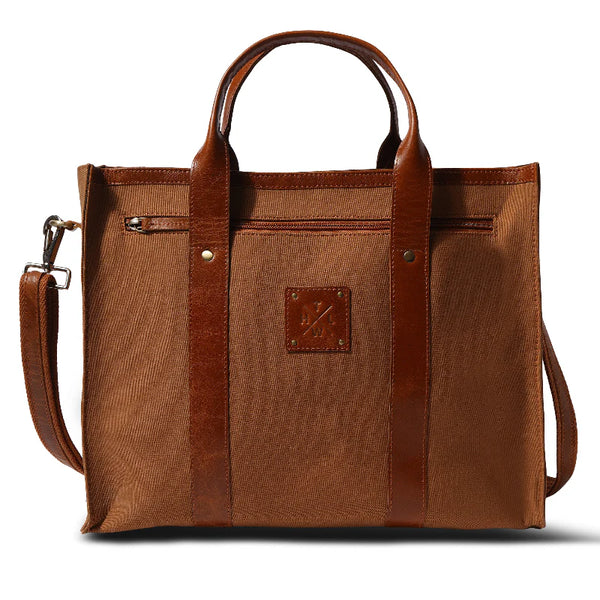 Brown tote bag with leather accents on a white background