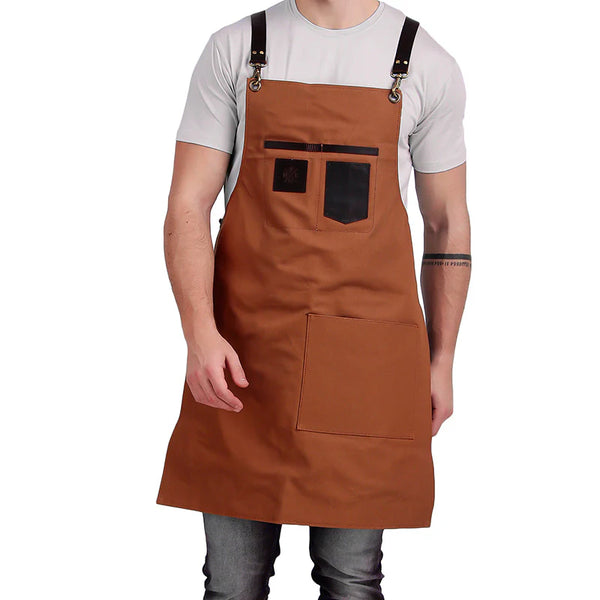 Brown apron with black accents worn by a person on a white background