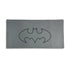 Gray mouse pad with a black Batman logo on a white background