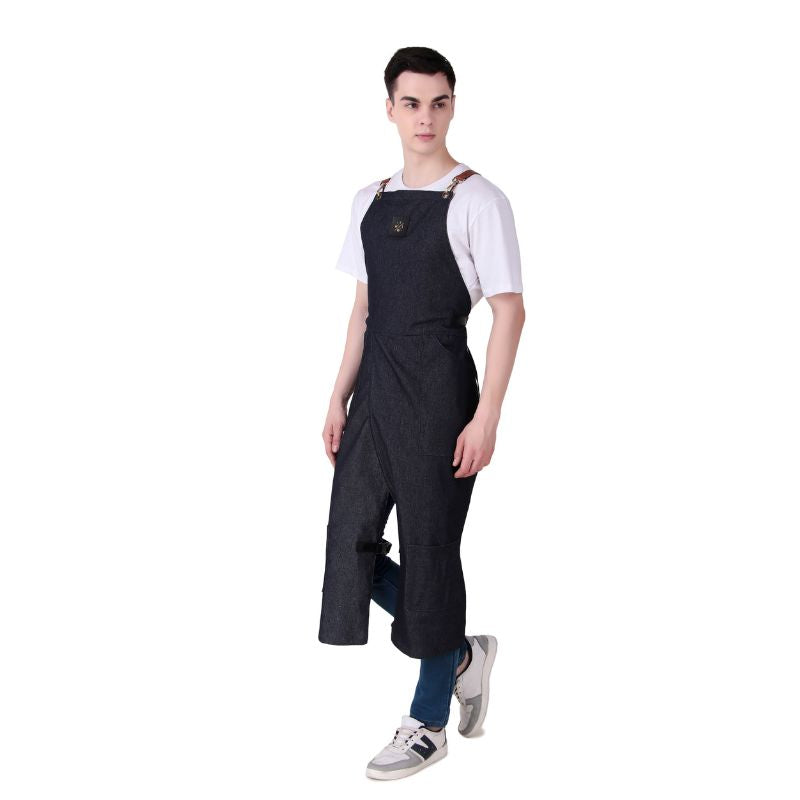 Person wearing a black apron over a white shirt on a white background