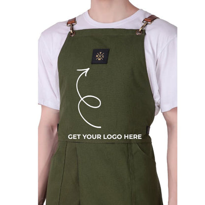 Green apron with a logo patch and text &