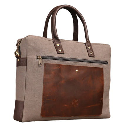 Brown and beige handbag with leather accents on a white background