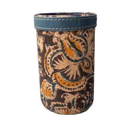 Decorative cup sleeve with intricate patterns on a white background