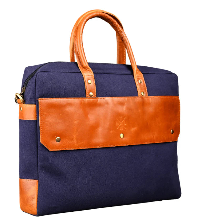 Navy blue bag with brown leather accents on a white background