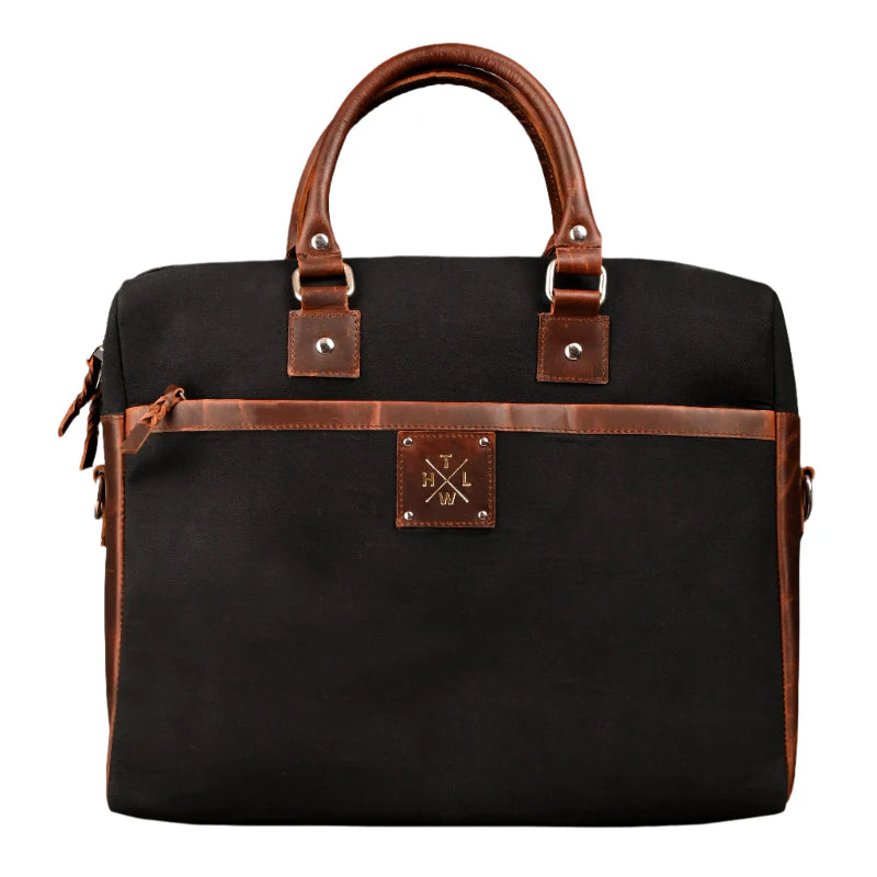 Black bag with brown leather accents on a white background