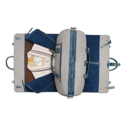 Open suitcase with clothing items on a white background