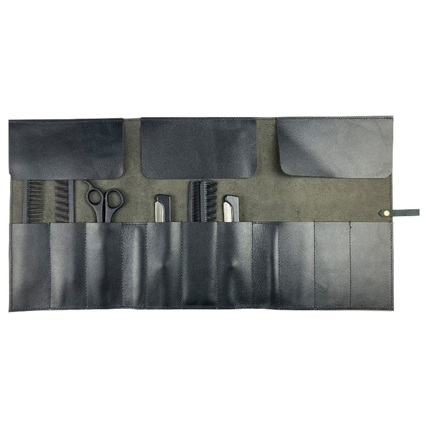 Set of grooming tools in a black and gray roll-up case on a white background