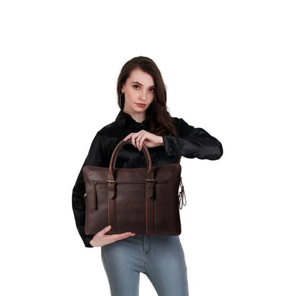 Woman holding a brown leather bag against a white background