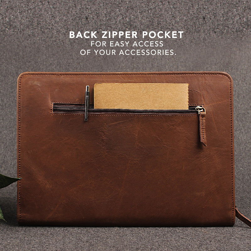 Brown leather pouch with back zipper pocket on a gray background